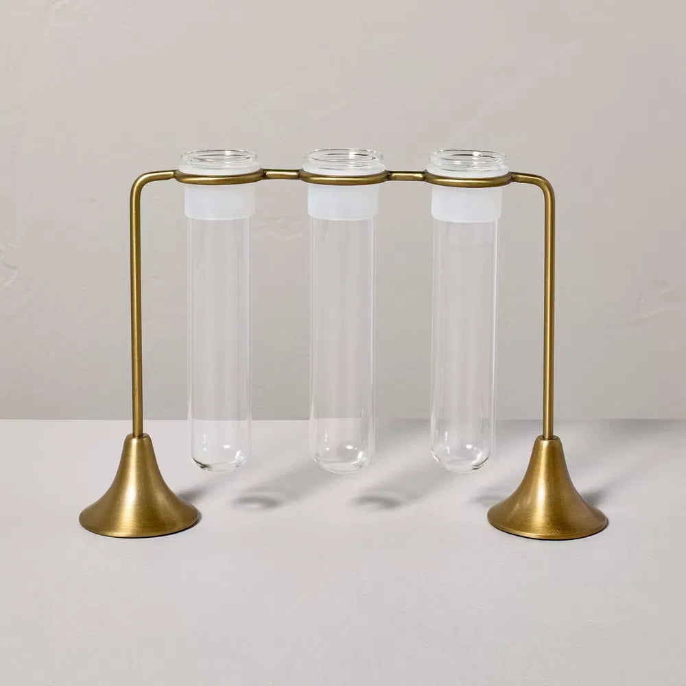 Three glass propagation tubes in a brass stand