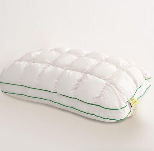 White quilted puff pillow with green piping