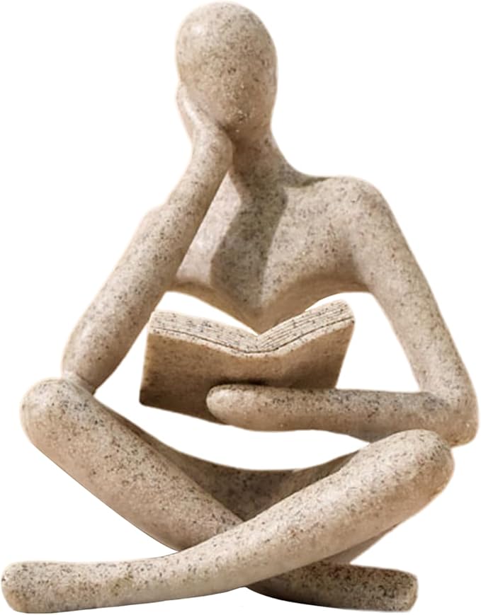 Beige abstract thinker statue reading a book