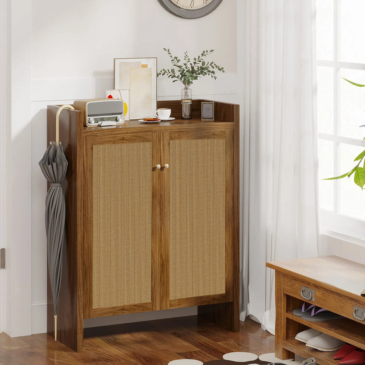 Natural-finish rattan shoe cabinet styled in an entryway