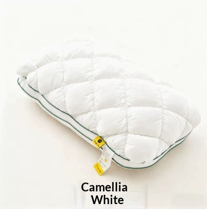 White quilted puff pillow with green piping