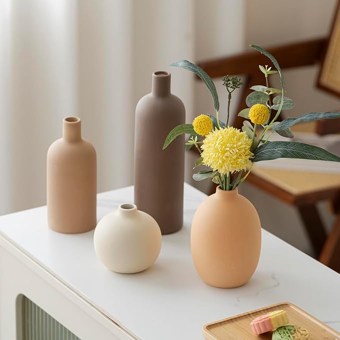 Neutral ceramic vases with fresh flowers